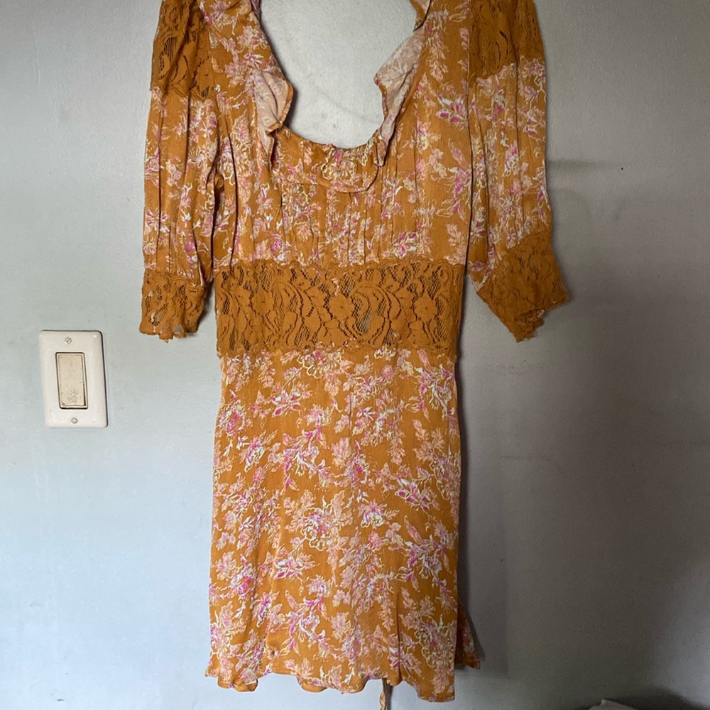 Free People Beautiful tea time dress! Lace around belly is a little showy....
